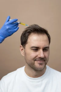 smiley man getting prp injection